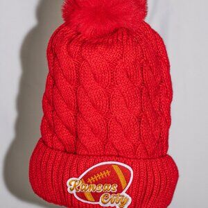 Red stocking cap with K C Chiefs Football patch and fuzzy lining